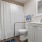 bathroom with a large mirror